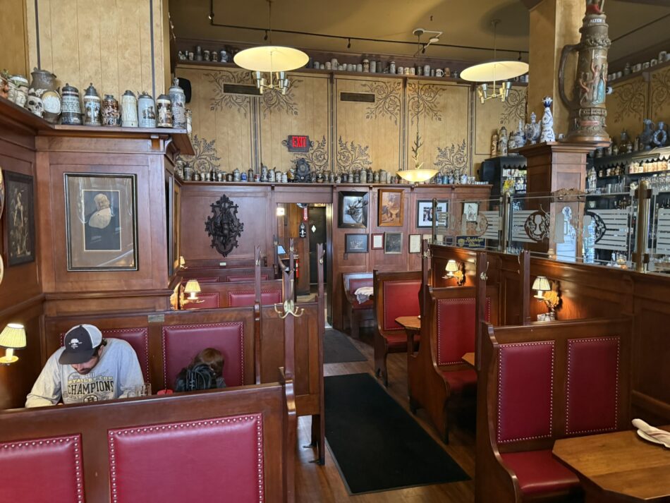 The original booth area of The Student Prince in Springfield, with antique beer steins lining the walls.